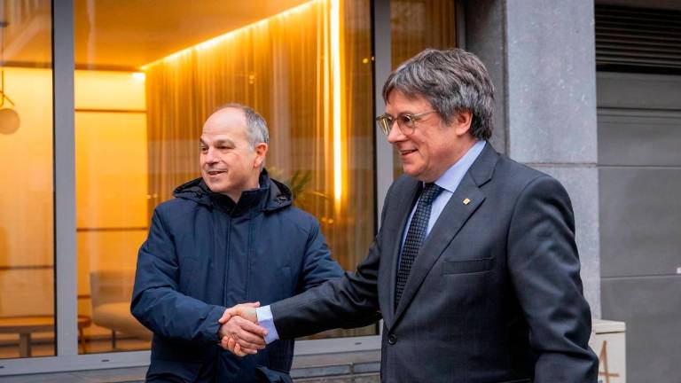 Jordi Turull y Carles Puigdemont. Foto: EFE