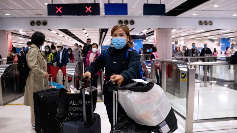 Gente con mascarilla en China. Foto: EFE