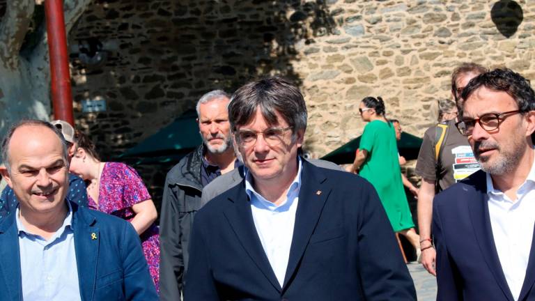 Jordi Turull, Carles Puigdemont u Josep Rius, en un acte de campanya del passat divendres 10 de maig a Cotlliure. Foto: ACN